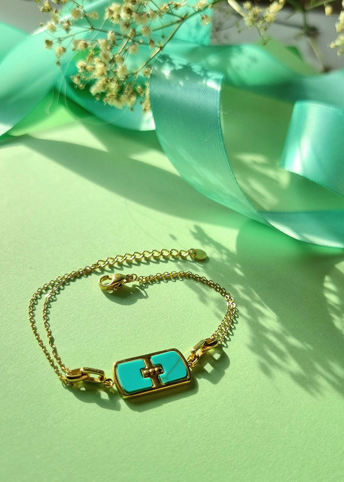 Armkettchen goldfarben, Edelstahl mit Perlmutt-Anhänger türkis– Doppelreihig