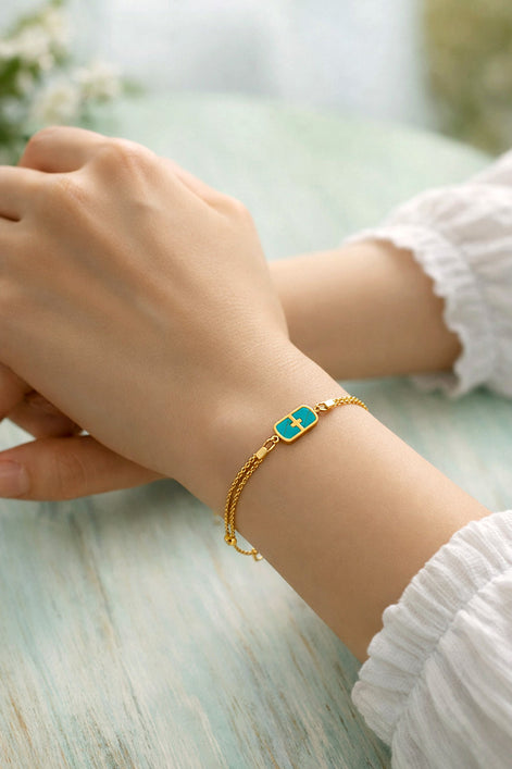 Armkettchen goldfarben, Edelstahl mit Perlmutt-Anhänger türkis– Doppelreihig