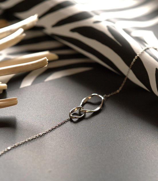 Bracelet silver-colored – with intertwined rings