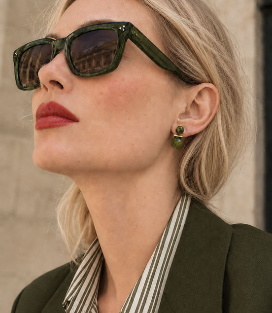 Green earrings with a sophisticated double-pearl look