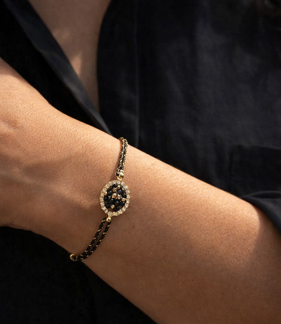 Cord bracelet with glass beads & oval element – black & gold