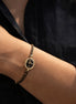 Bracelet cordon avec perles en verre et élément ovale – noir et doré