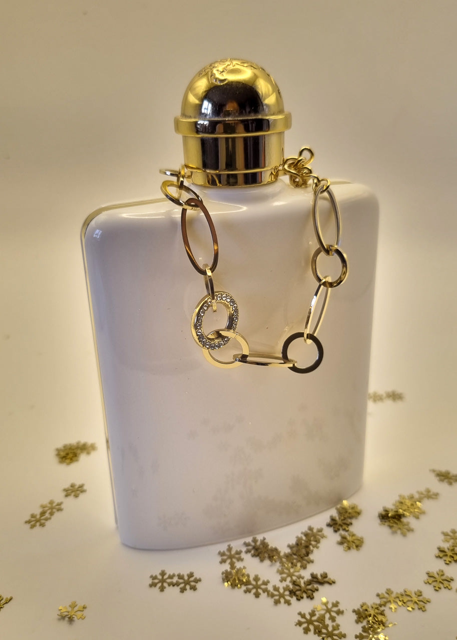 Armband aus goldfarbenen Edelstahlgliedern mit Strass besetztem Mittelring