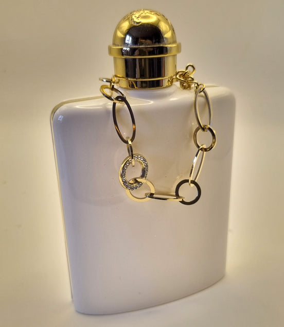 Armband aus goldfarbenen Edelstahlgliedern mit Strass besetztem Mittelring