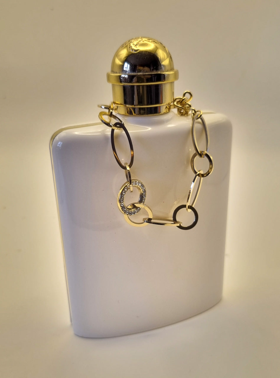 Armband aus goldfarbenen Edelstahlgliedern mit Strass besetztem Mittelring