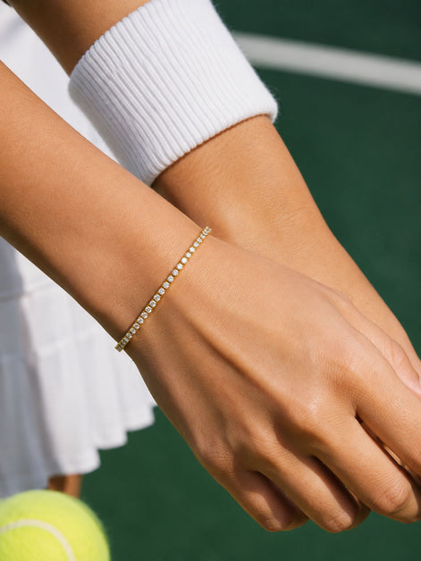 Tennisarmband goldfarben aus Edelstahl mit klaren Zirkonia-Steinen