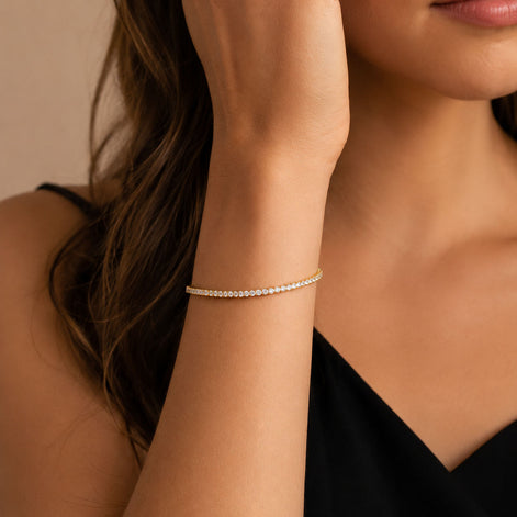 Tennisarmband goldfarben aus Edelstahl mit klaren Zirkonia-Steinen