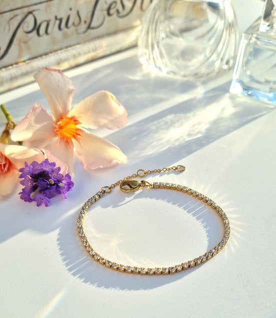 Gold-tone stainless steel tennis bracelet with clear zirconia stone